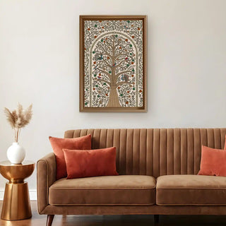 Anant Madhubani Tree of Life Wall Art framed above a cozy beige sofa with mustard cushions, blending traditional Indian art with modern minimal decor.