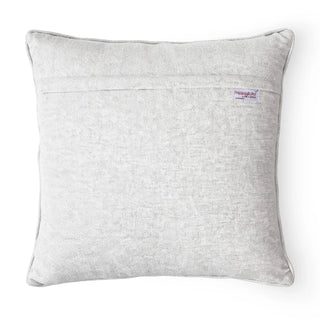 Solid light grey textured back of the Midnight Linea cushion cover showing the brand label.