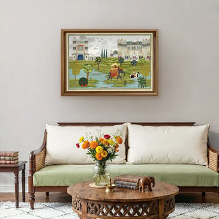 Bharat Rajasthani King Painting Wall Art framed above a traditional wooden sofa with white cushions and marigold flowers, enhancing a warm Indian-inspired interior.
