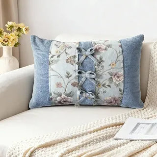 Eternal Garden bow cushion on a white sofa.