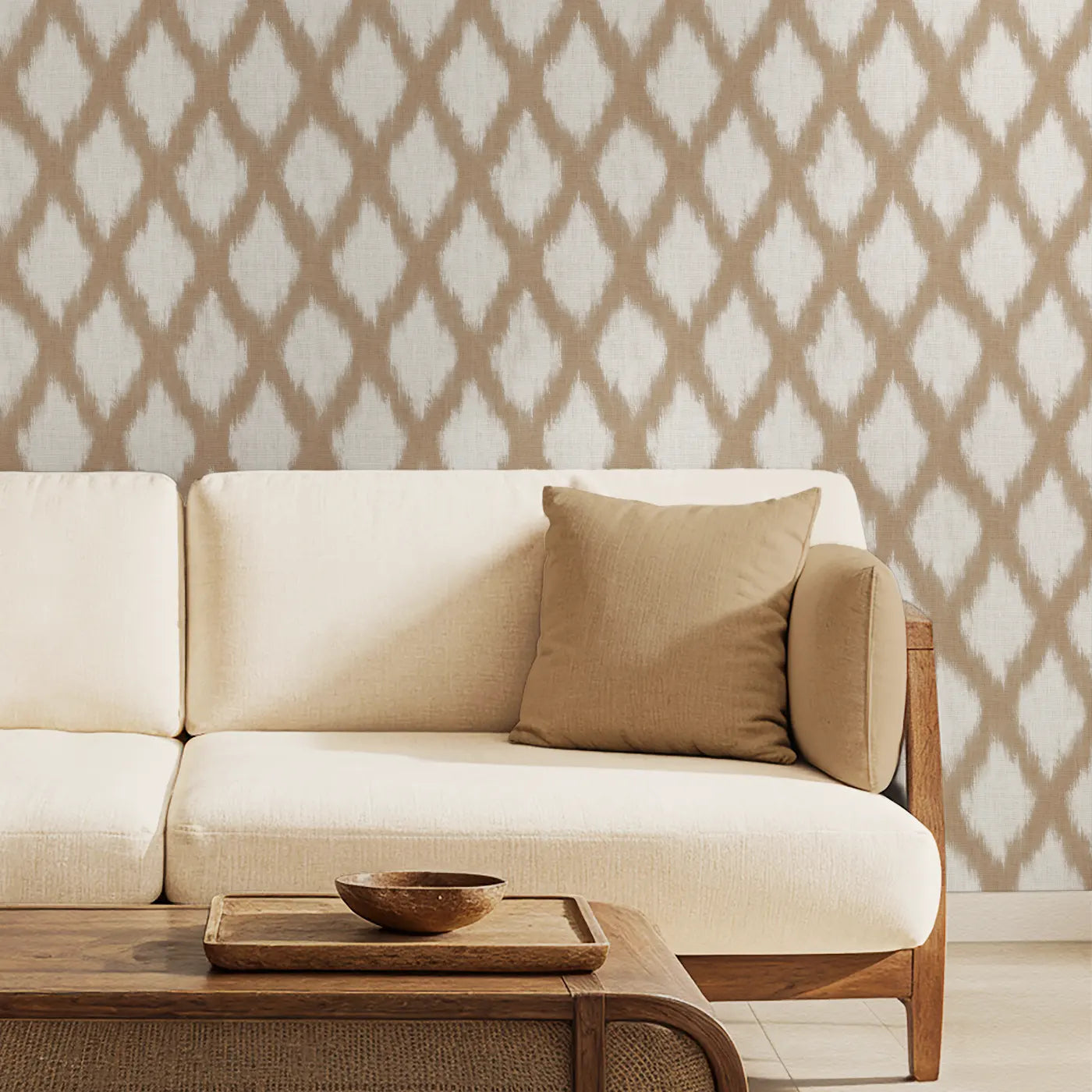 Classic Indian ikat repeat pattern wallpaper in beige behind a sofa in a living room