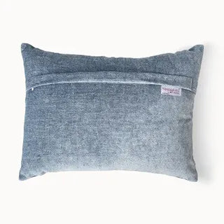 Back of cushion showing blue velvet and zipper.