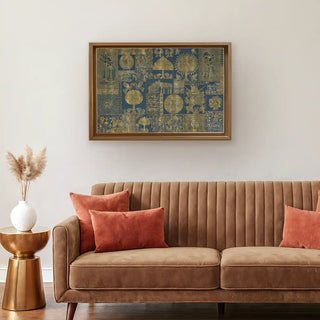 Geet Madhubani gold and blue wall art styled above a brown velvet sofa, adding warmth and heritage charm to a modern living space.