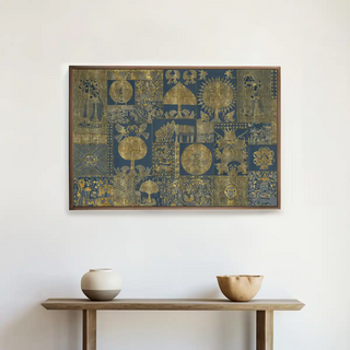 Geet Madhubani gold and blue wall art framed above a minimalist console table, infusing Indian artistic flair into contemporary decor.