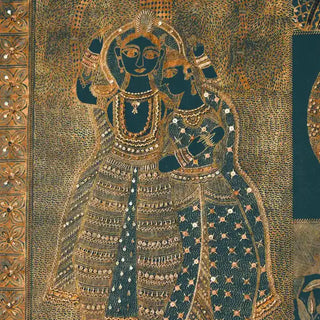 Close-up of Geet Madhubani Indian Wall Art showing detailed hand-style patterns of Radha-Krishna in gold accents on rich blue background.