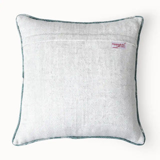 The Graceful Cranes Patch Cushion Cover: Back view showing the smooth, plain cream/offwhite linen fabric and quality tag.