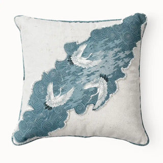 The Graceful Cranes Patch Cushion Cover: Front view of a cushion featuring cranes over a blue panel. The mix of natural linen and patchwork gives it a refined, contemporary appeal.