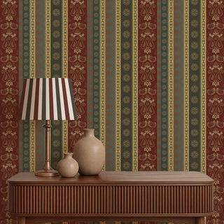 Decorative table with lamp and vases against a patterned wallpaper.