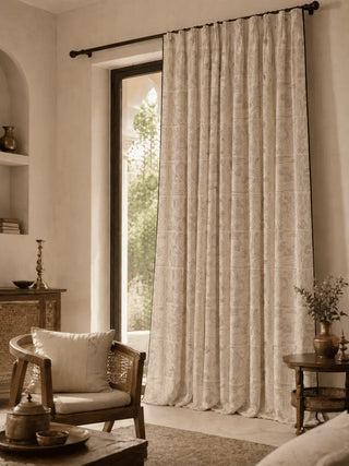 Living room with a large window draped with kantha curtain from lifencolors