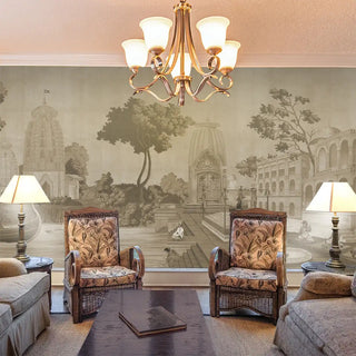 Living room with ornate chairs, a chandelier, and decorative wall mural.