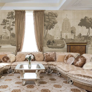 Luxurious living room with a large sectional sofa, decorative pillows, and a coffee table with wallpaper