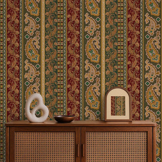 Decorative wall with intricate paisley pattern, wooden cabinet with decorative items, and patterned wallpaper.
