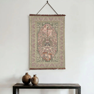 A beautiful Kashmiriyat Embroidered Wall Art piece, showcasing traditional patterns and figures, hung on a white wall above a console table with decorative vases. 