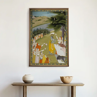 Krishna with Gopies Indian Vintage Wall Art displayed above a wooden console table with earthen pots, exuding a spiritual and artistic ambience.