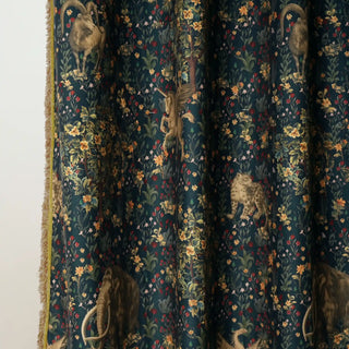 Close-up view of Majestica Readymade Curtain showcasing detailed animal motifs and floral artistry on a rich deep teal base.
