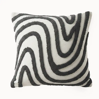 Front view Mono swirl Cushion Cover Featuring raised tufted black patterns flowing in wavy motion