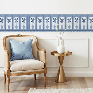 Monsoon Arches Border Wallpaper: Blue and white decorative strip installed above wainscoting in an elegant sitting area.