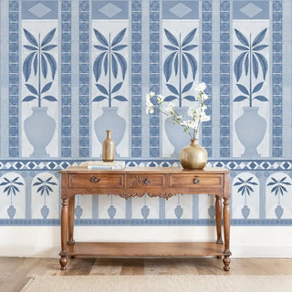 Monsoon Arches Mural Wallpaper: Full wall installation of the blue and white decorative mural with repeating vase and stylized plant patterns.