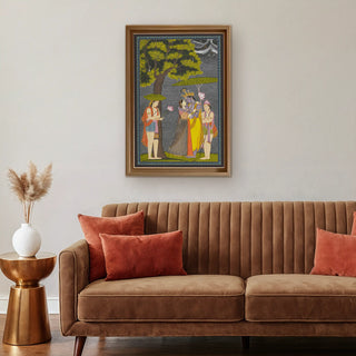 Radha Krishna Vintage Indian Wall Art framed above a brown velvet sofa with terracotta cushions, merging classical Indian art with modern luxury interiors.