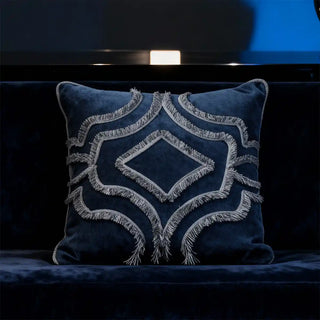  Regal Crest Fringe Cushion Cover: Navy blue chenille cushion with textured fringe embroidery. Styled on a regal sofa in moody environment.