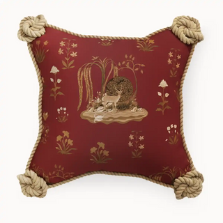 Front view of Rustic Malhar Cushion Cover delicate golden floral motifs. Finished with chunky knotted rope details on each corner.