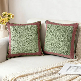 Sage Cushion Cover: Soft sage center ruched cushion detailed with Green ruched velvet on the center framed with pink velvet. Styled on a cozy neutral sofa.
