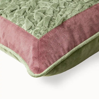 Sage Cushion Cover: Closeup view of the green and pink ruched velvet cushion.