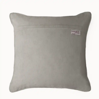 The back view of the Serene Strokes cushion cover in plain beige velvet, highlighting a concealed zipper closure for a neat and polished appearance.