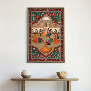Sorena Wall Art displayed above a wooden console with pottery decor, highlighting vibrant colors and intricate details of Indian artistic heritage.