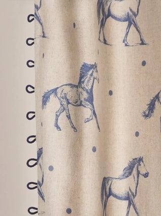 Stallion Readymade Curtain in Linen readymade curtain, close-up highlighting the unique border detailing on the left edge of the curtain. The image clearly captures the artisanal ink-blue side loops extending outward...