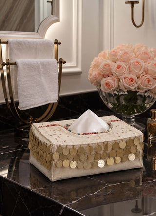 The Pitara tissue case in Oatmeal, view-bathroom beside a rose bouquet and towel rack.