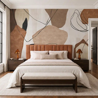The Abstract Ochre wallpaper installed behind a tan leather channel-tufted headboard in a bedroom view-bedroom
