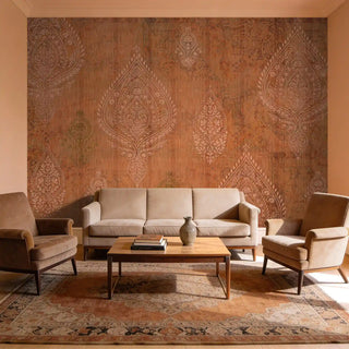 A grand living room featuring the Afsana mural behind a contemporary beige sofa and tan armchairs.