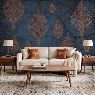 A luxury living room featuring the Afsana Teal Blue mural behind a white sofa with rust-colored velvet cushions.
