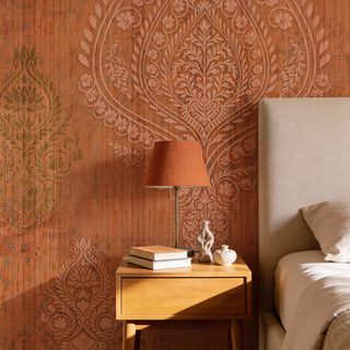 The Afsana mural styled in a luxury bedroom as a feature wall behind a neutral headboard and terracotta lamp.
