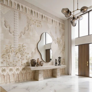 The Alhambra’s Whisper warm sandstone neutral wallpaper mural styled inside a high-ceiling luxury open hall next to an organic stone entryway console.