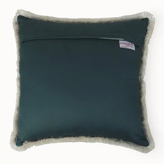 The back view of the Amer Lattice cushion showing the smooth teal-blue velvet finish and brand label.