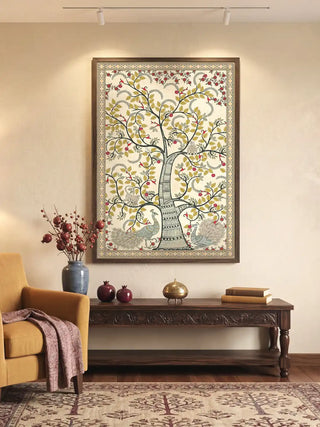 A luxury grand foyer setting featuring the large Anant Vriksha framed art above a carved wooden console table.