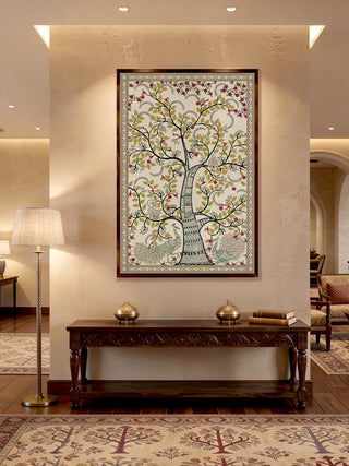 A sophisticated living room styling showing the Anant Vriksha wall art paired with a yellow armchair and traditional decor.