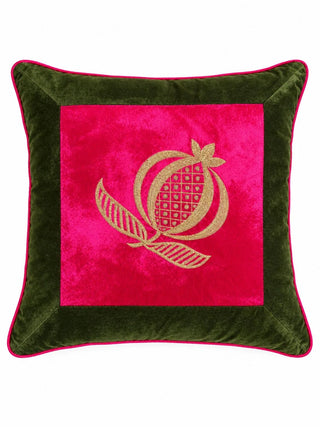 The square Anarkali cushion cover showing a gold-embroidered pomegranate on a fuchsia velvet panel, framed in olive green velvet with pink piping.