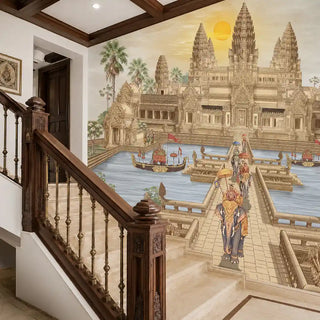 The Angkor Wat wallpaper mural in Gold & Sepia installed on a feature wall beside a staircase, depicting the temple towers, naga-prow boats and a ceremonial elephant procession. view-staircase