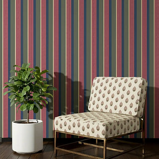 Arang Sofa and Chair Upholstery Fabric in ivory with bold leaf motifs, styled on a lounge chair.