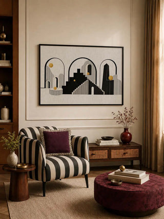 The Arches of Ascent framed architectural artwork styled inside a chic sitting lounge with a black-and-white striped armchair.