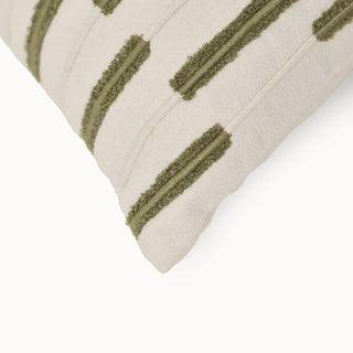 A macro close-up of the Ari Garden cushion highlighting the tufted embroidery and woven fabric details.
