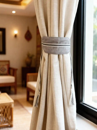 Beige curtain with a decorative ashline tieback  by lifencolors in a living room setting