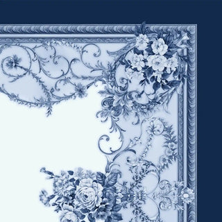 Close-up detail of the Aurelia ceiling wallpaper border featuring baroque scrollwork, florals, and chain motifs in blue.
