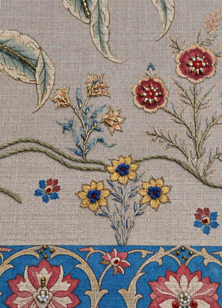 A detailed macro close-up of the Bagh-e-Noor embroidered wall art highlighting hand-worked florets, seed-bead centres and couched metallic-thread stems.