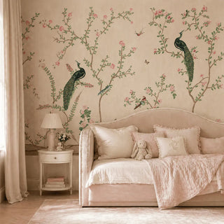 Neatly made bed with decorative pillows and a teddy bear in a room with floral wall design. view-kids room