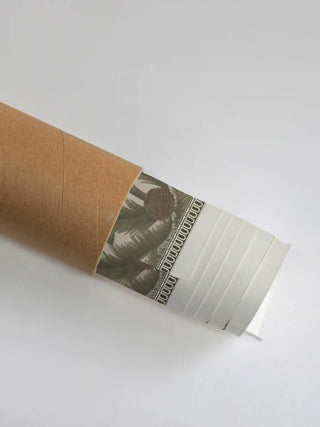 Premium protective packaging tube showing the rolled Bali wall art print ready for shipping.