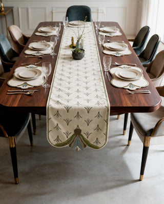The Barg table runner in Moss & Teal laid the full length of a long dining table set for ten.